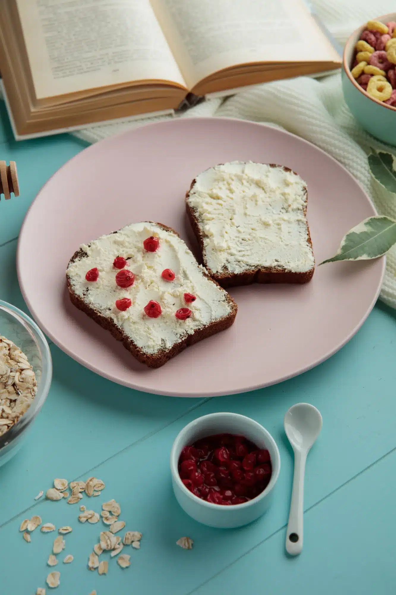 Gluten-free dairy-free breakfast with toast, dairy-free spread, and red berries on a pink plate