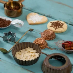 Baking tools and ingredients for Moon Spell Cookies Recipe displayed on a rustic wooden surface.