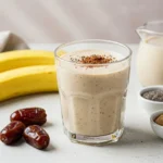 Glass of Banana-Date Chia Smoothie with ingredients around it