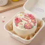 Decorated mini bento cake in lunchbox container