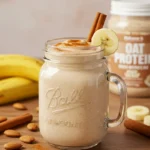 Cinnamon-Bun Protein Shake in mason jar with banana and cinnamon