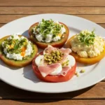 Overhead shot of three heirloom tomato slices with toppings on a serving platter
