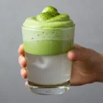 Cloud matcha with whipped green top and coconut water base in glass