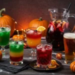 A spooky Halloween cocktail spread with five colorful drinks: green Witch’s Brew, layered shot, fruity sangria, red cocktail, and pumpkin beer, styled with pumpkins and cobwebs.
